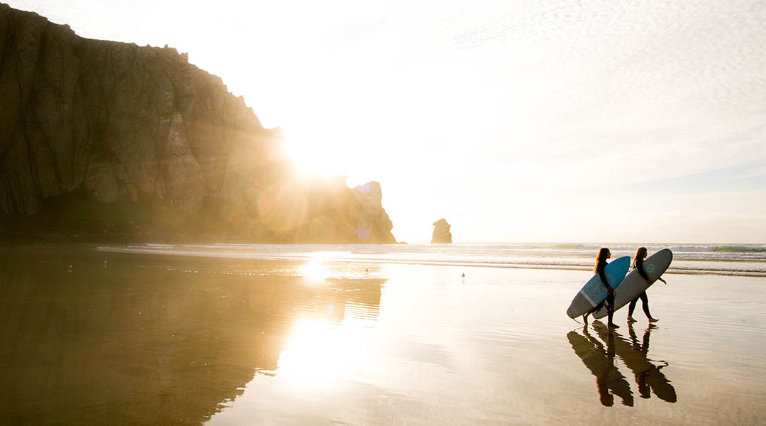 surfers on beach