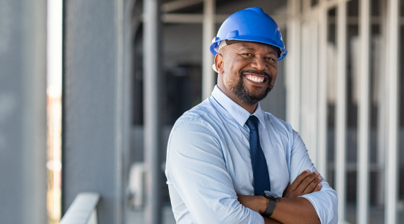 smiling business man in hard hat