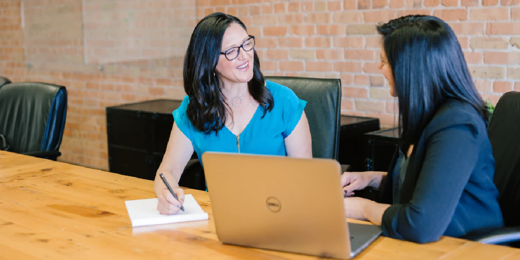 employees discussing a tax-deferred retirement plan