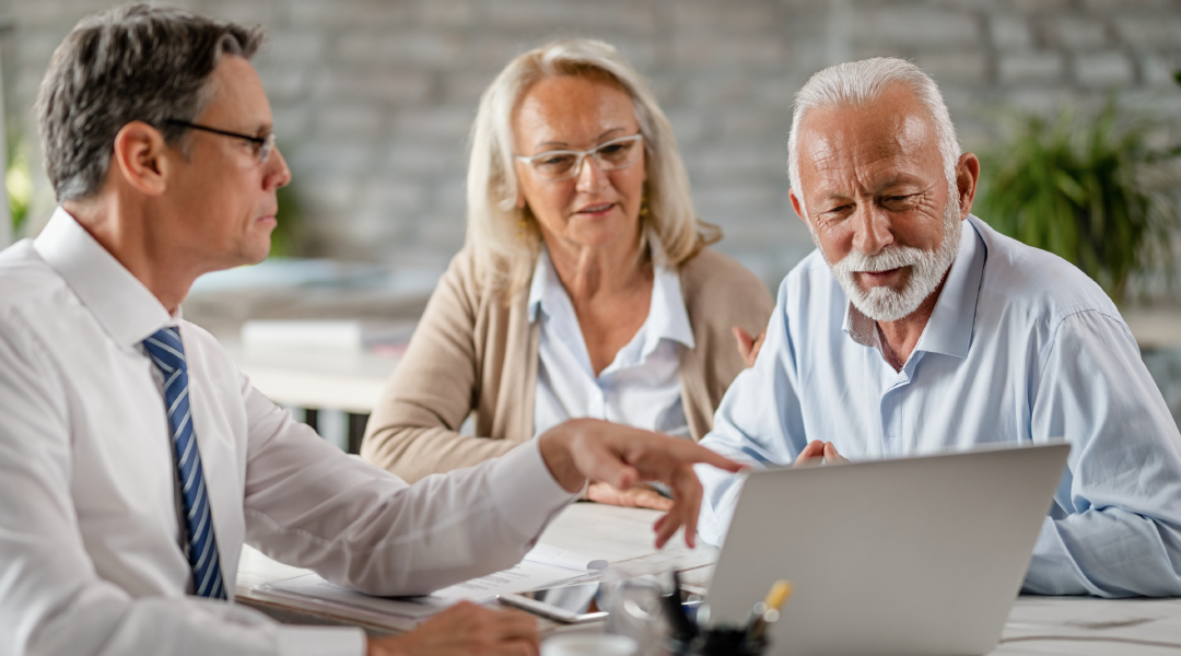 couple discussing with retirement plan advisor