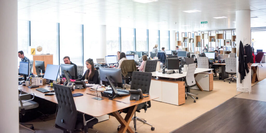 busy office building with employees at desks