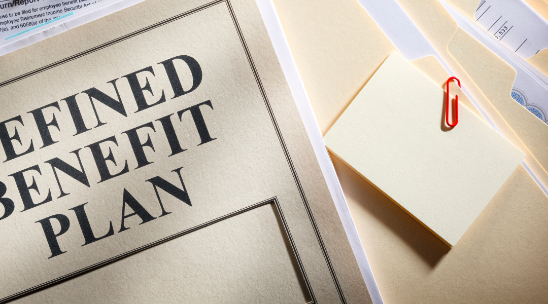 Splayed out file folders with the top one saying "defined benefit plan."