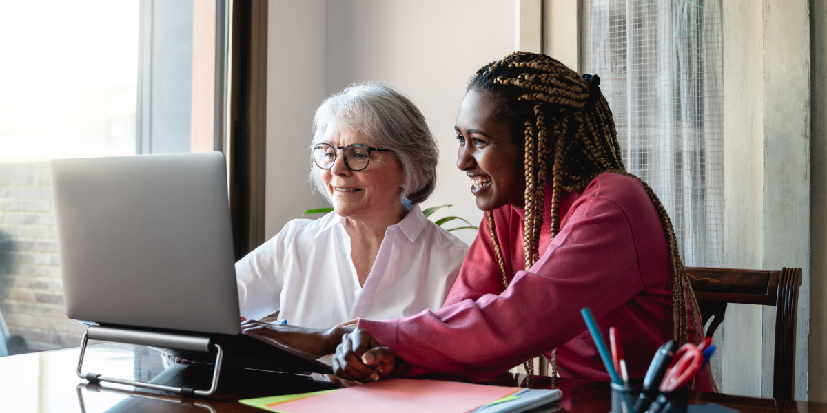 TPA and employer discussing ERISA Section 404(c) over laptop