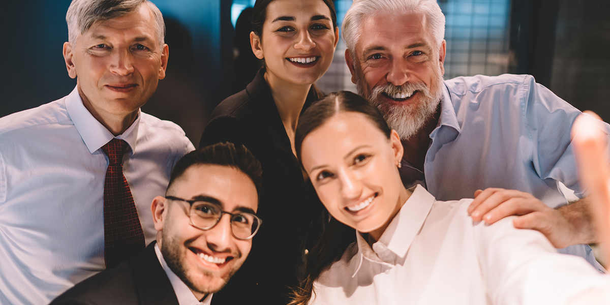 Group of diverse colleagues looking at camera