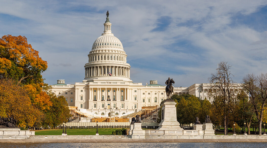 The US Capitol in Washington DC surrounded by vibrant autumn foliage