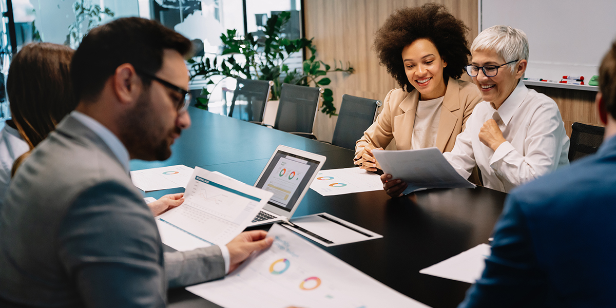 Business colleagues in conference meeting room during presentation